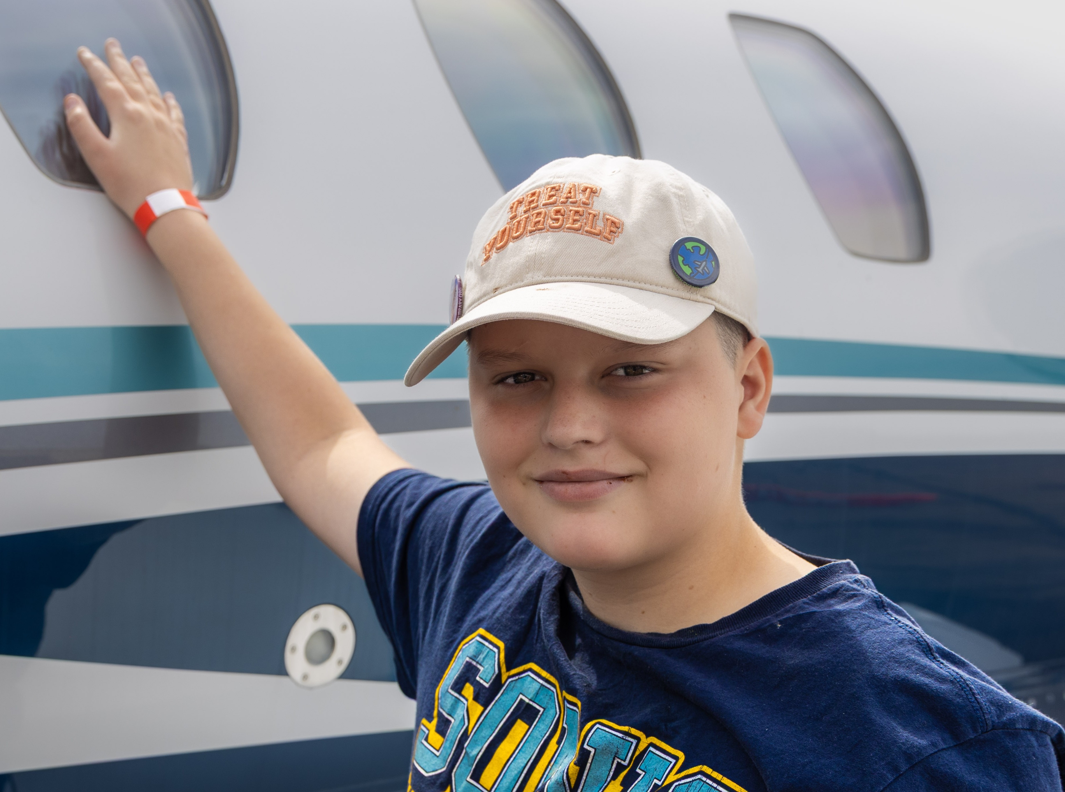 Blake smiling touch blue and white plane