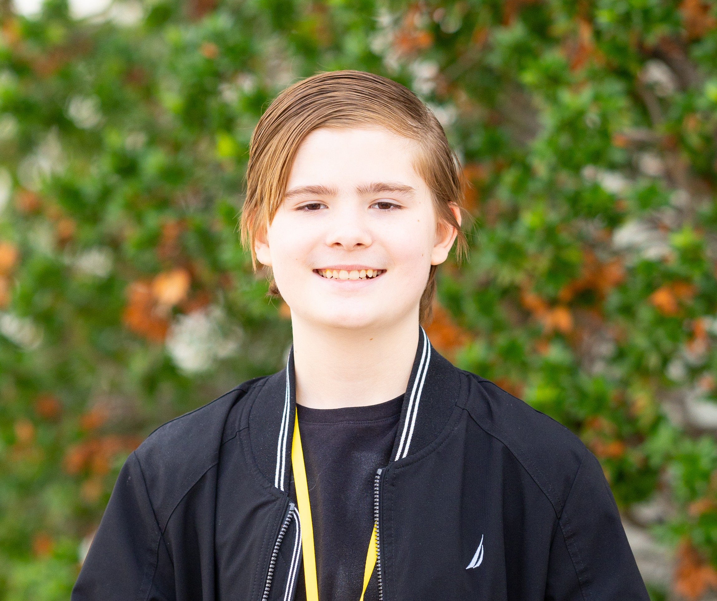 Ethan head shot with bush in background