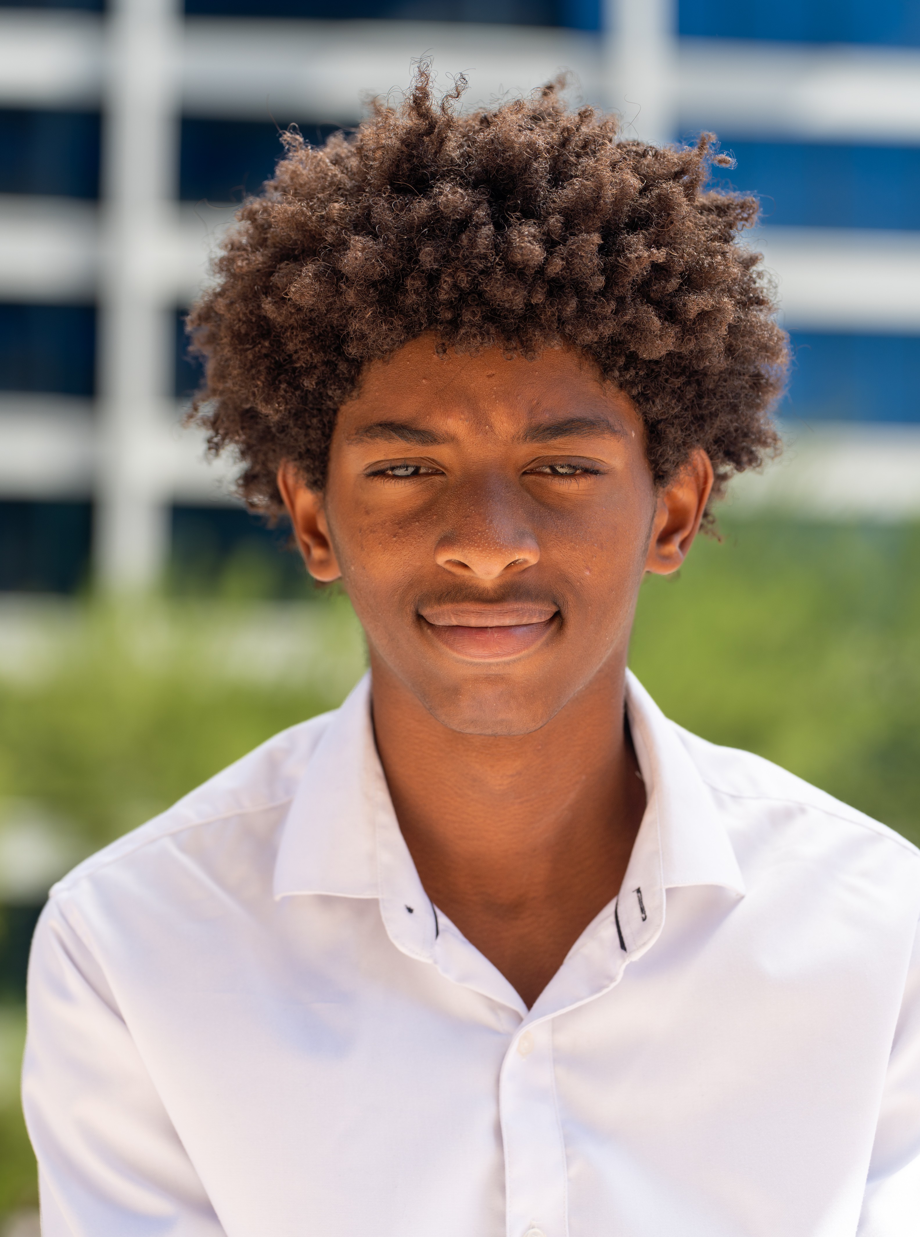 Isaiah headshot with building in background