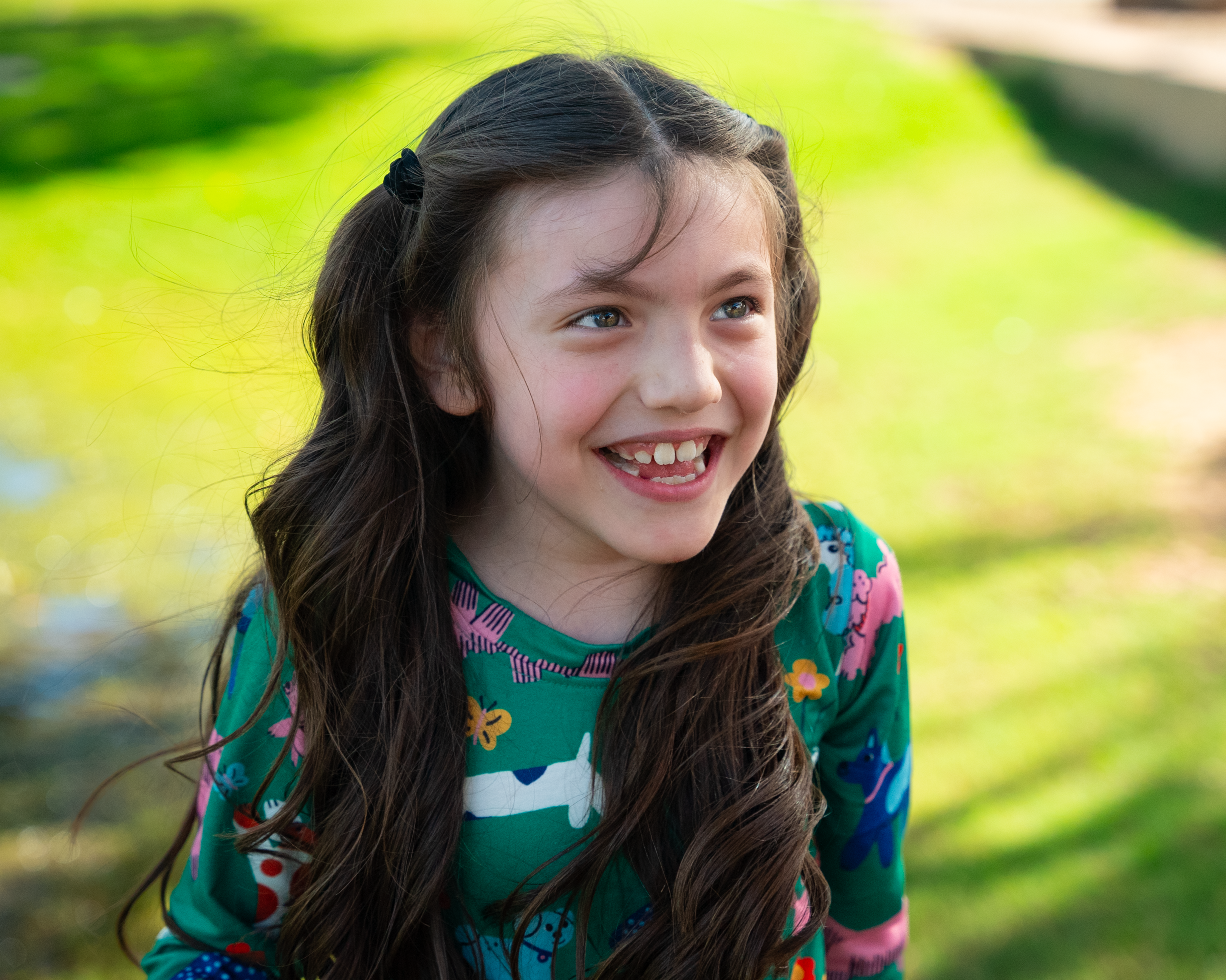 Samantha smiling green grass