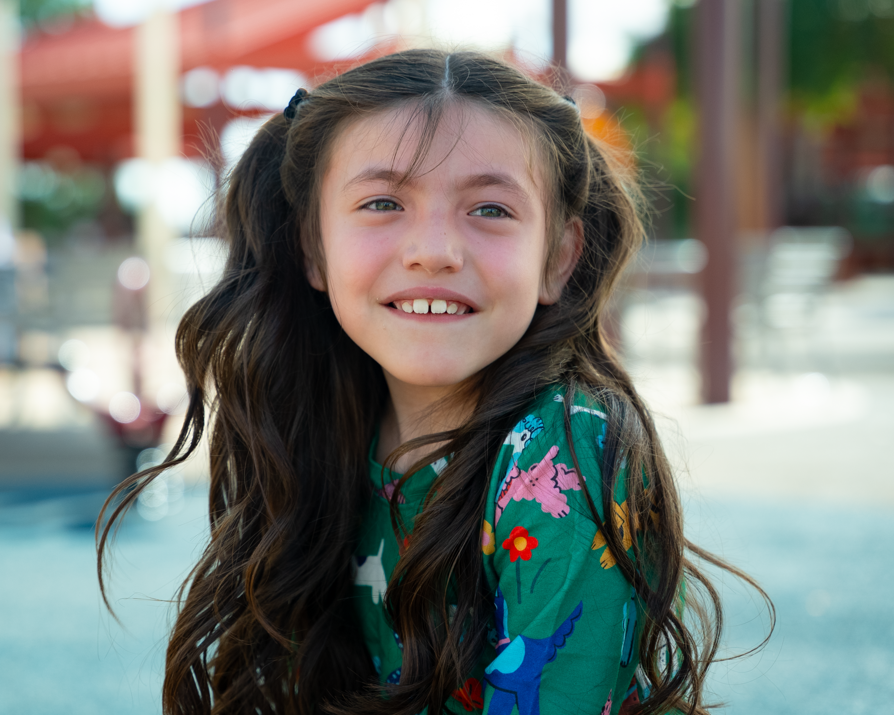 Samantha smiling on playground