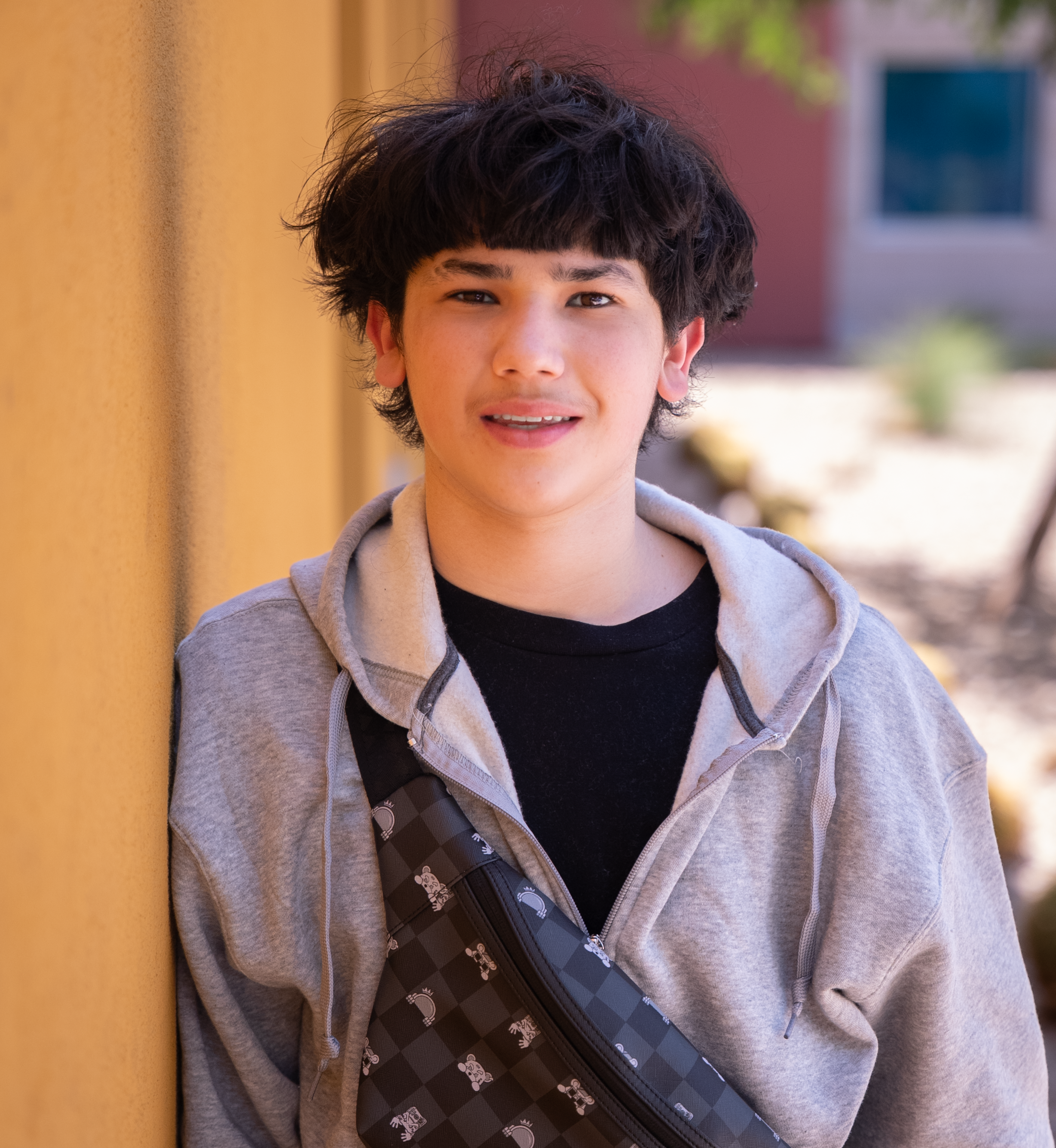 Angelo leaning on wall