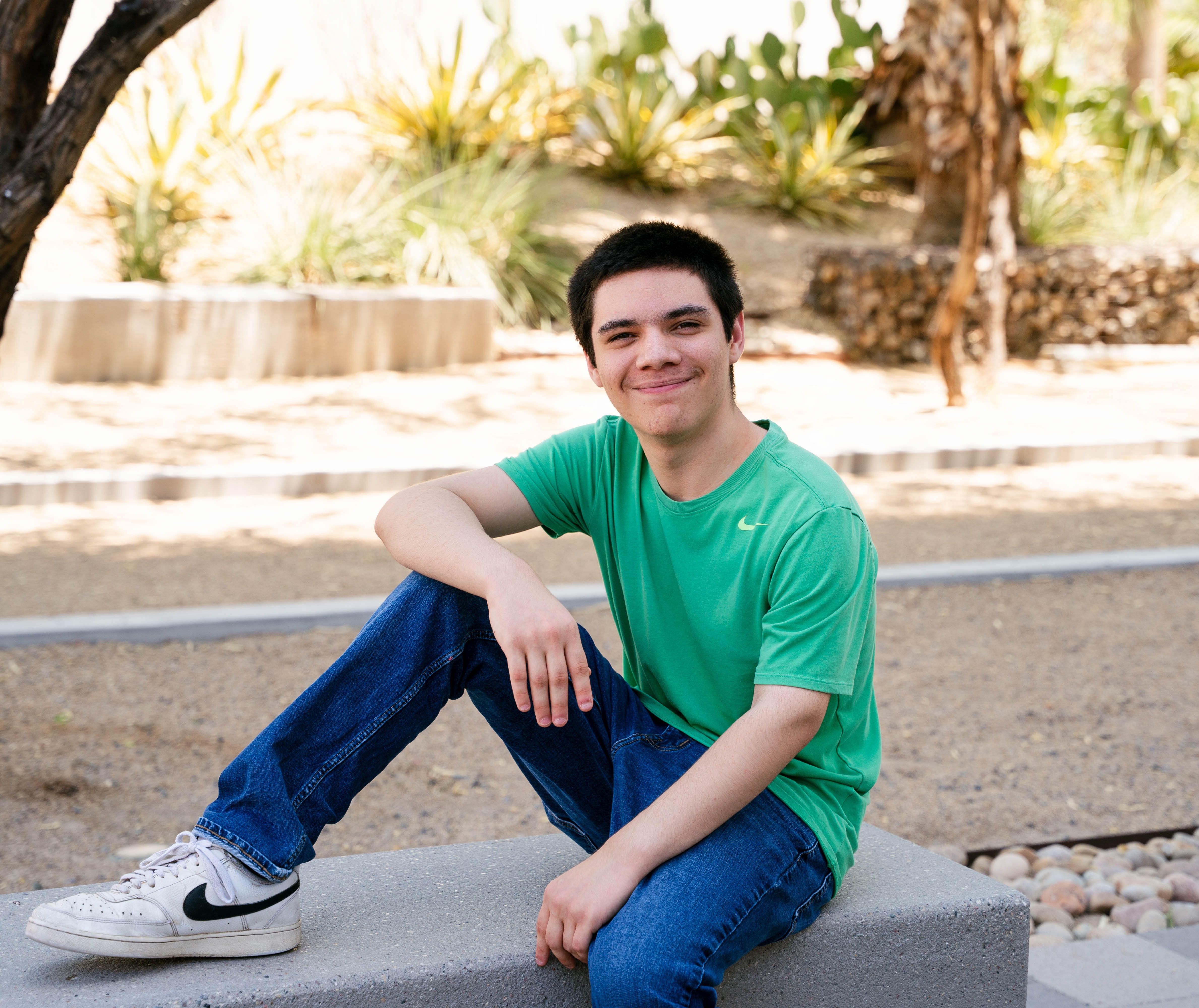 Caleb sitting on wall