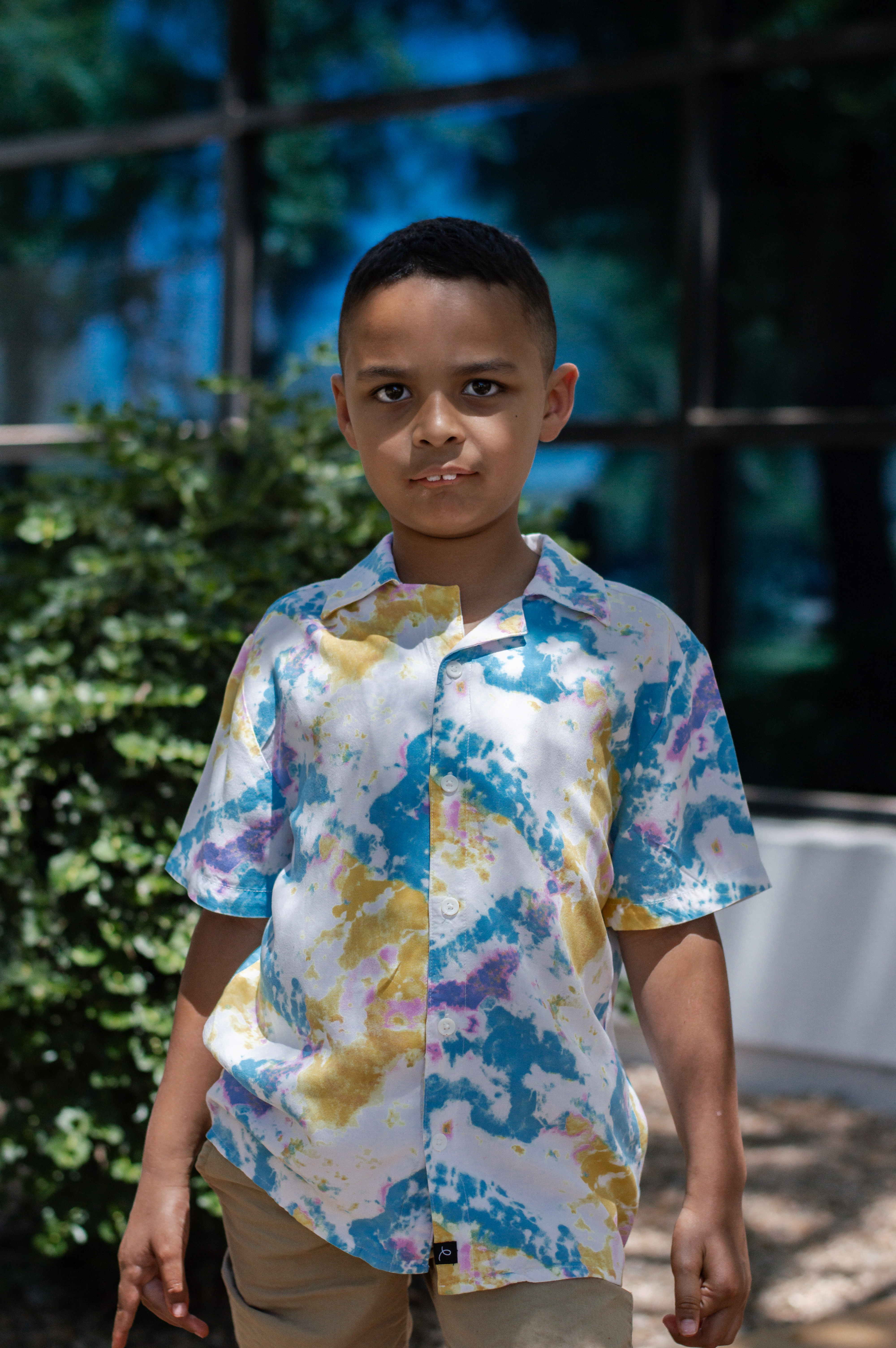 Matthew standing with trees in background