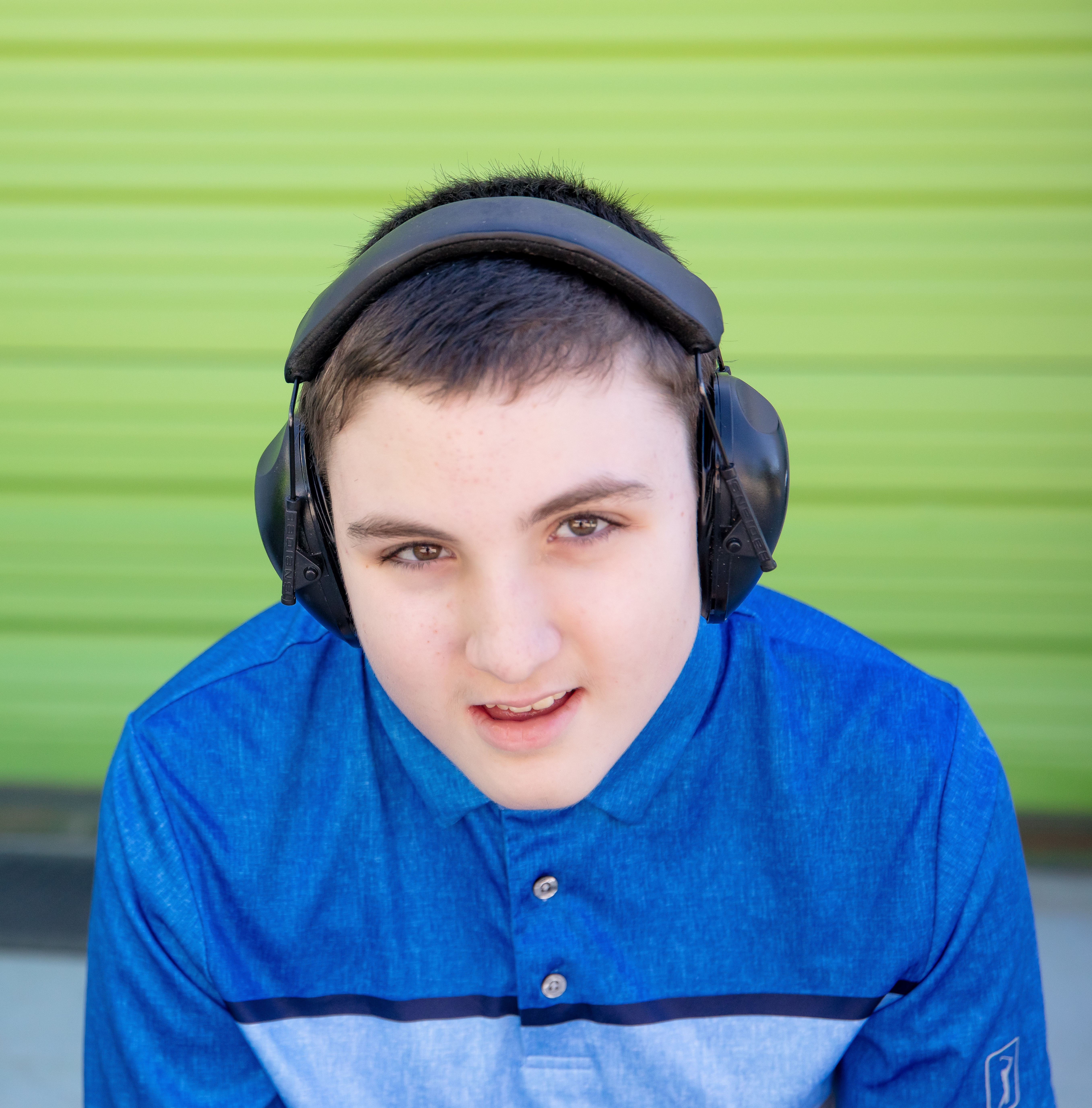 Gage with green wall in background