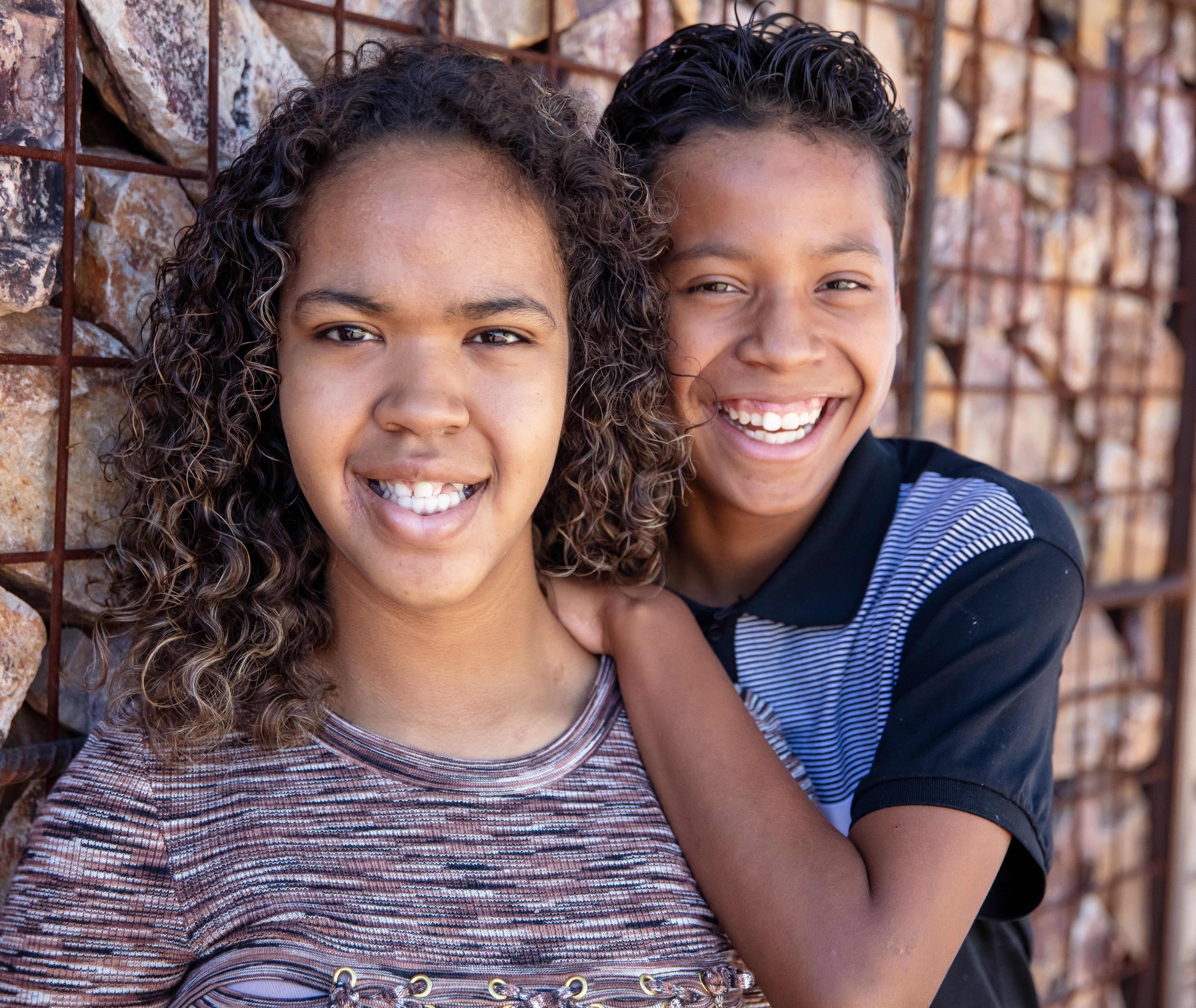 Rayne and Skylar with rock wall in background