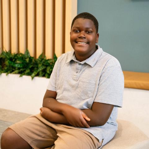 Kevin sitting down with arms crossed