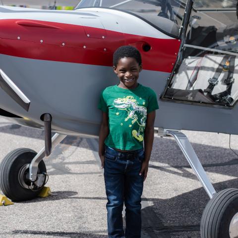 Messiah standing in front of the nose of the plane